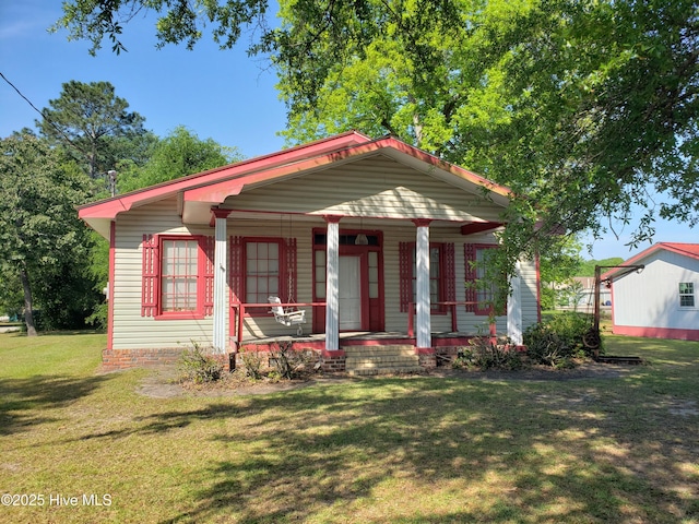 809 Conway Rd, Fair Bluff, NC 28439 - view of front of property featuring covered porch and a front lawn