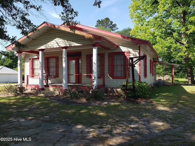 809 Conway Rd, Fair Bluff, NC 28439 - view of front of property featuring covered porch and a front yard