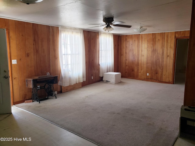 809 Conway Rd, Fair Bluff, NC 28439 - unfurnished living room featuring a ceiling fan, wood walls, and carpet