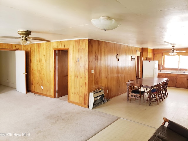 809 Conway Rd, Fair Bluff, NC 28439 - dining room featuring wooden walls, a ceiling fan, and heating unit