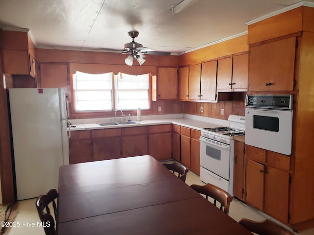 809 Conway Rd, Fair Bluff, NC 28439 - kitchen with white appliances, a sink, a ceiling fan, and light countertops