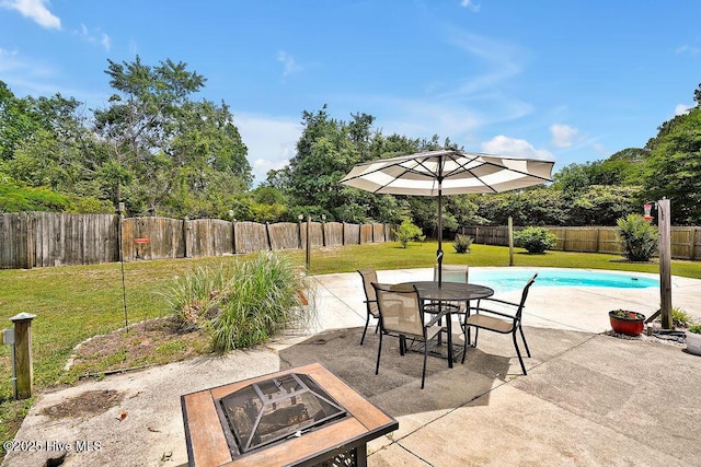 view of patio featuring a fire pit and outdoor dining space