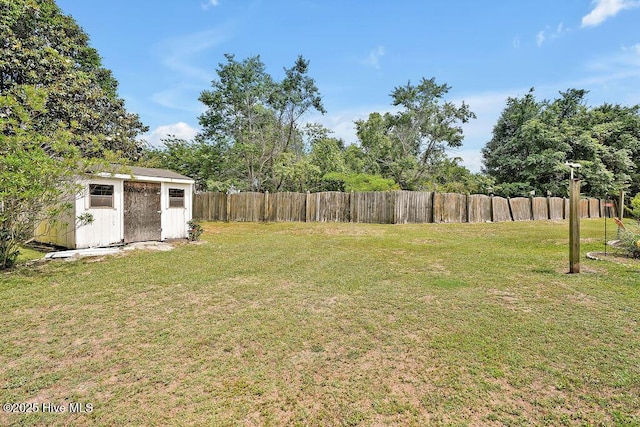view of yard featuring a storage unit and an outbuilding