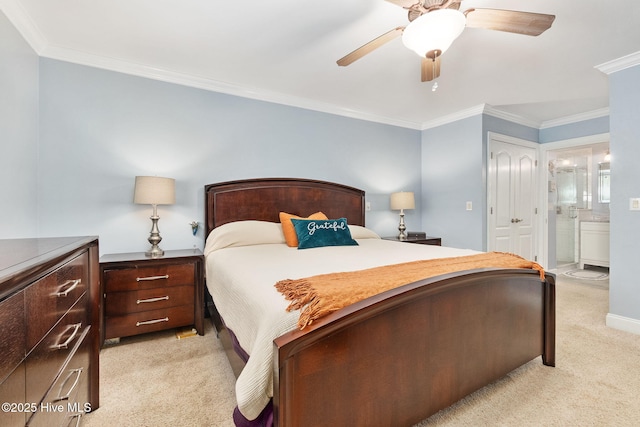 bedroom featuring light carpet, ornamental molding, a closet, connected bathroom, and ceiling fan