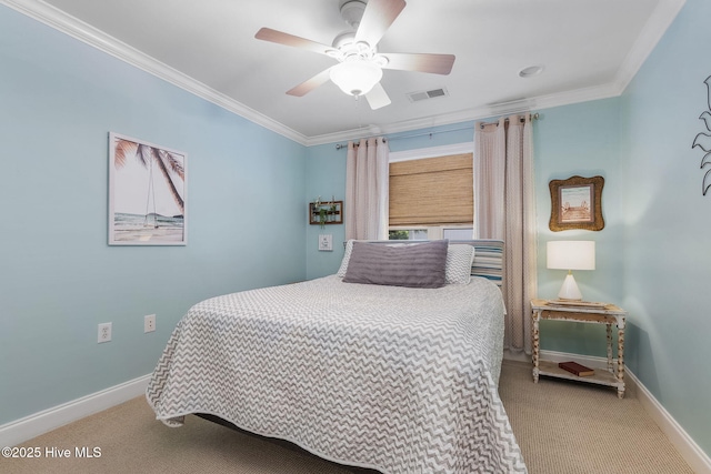 carpeted bedroom featuring baseboards, ornamental molding, and ceiling fan