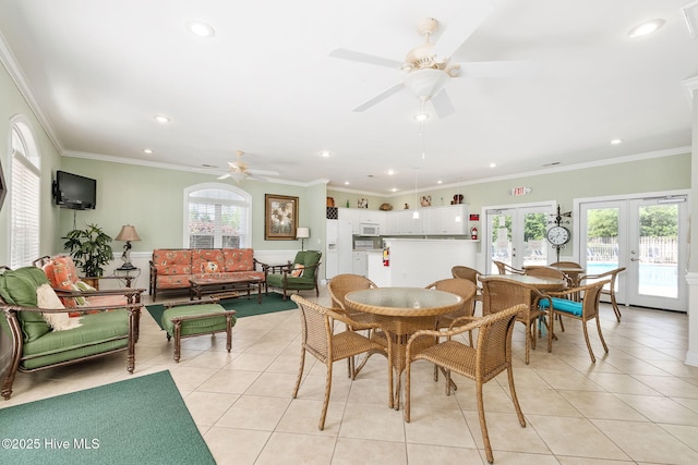 dining space with light tile patterned floors, french doors, ceiling fan, recessed lighting, and crown molding