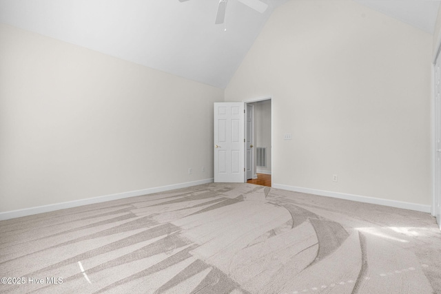 unfurnished bedroom with carpet flooring, high vaulted ceiling, baseboards, and a ceiling fan