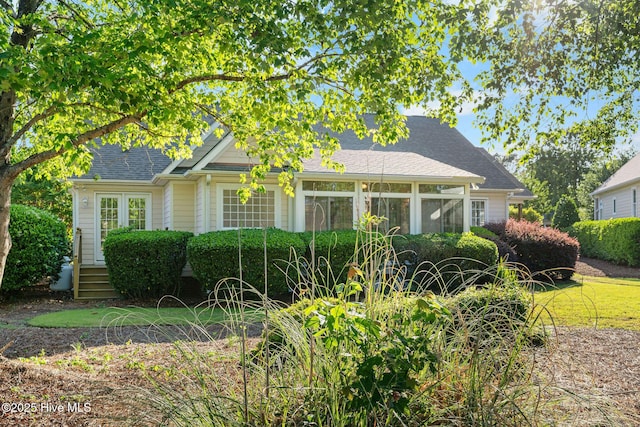 view of front of property with roof with shingles