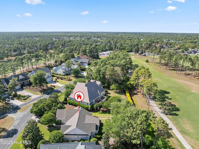 aerial perspective of suburban area with a tree filled landscape and a local golf course