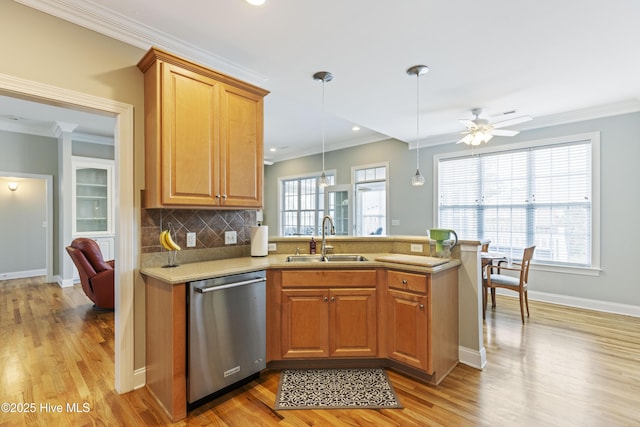 2016 Ashbrook Ct, Leland, NC 28451 - kitchen featuring dishwasher, a sink, a peninsula, light wood-style floors, and a ceiling fan