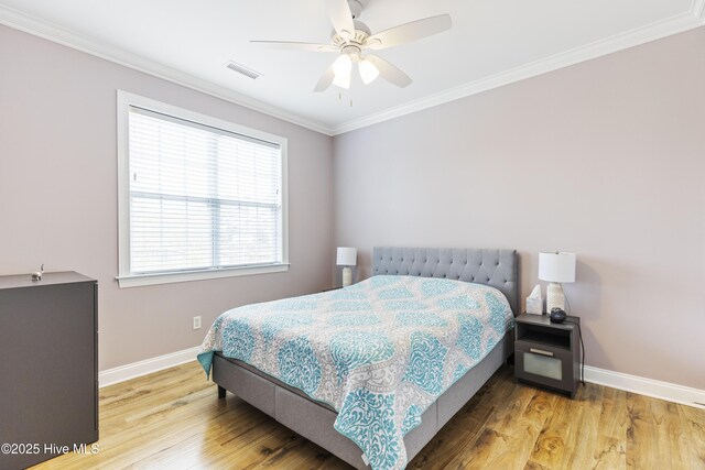 2016 Ashbrook Ct, Leland, NC 28451 - bedroom with baseboards, wood finished floors, ornamental molding, and ceiling fan