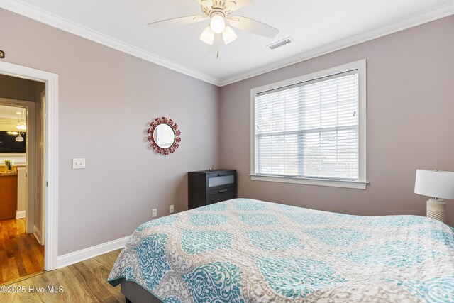 2016 Ashbrook Ct, Leland, NC 28451 - bedroom with wood finished floors, ornamental molding, baseboards, and a ceiling fan