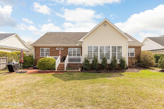 2016 Ashbrook Ct, Leland, NC 28451 - back of house featuring brick siding and roof with shingles