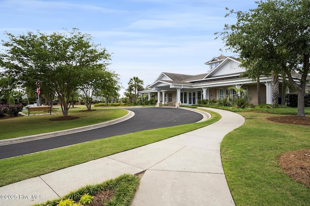 2016 Ashbrook Ct, Leland, NC 28451 - view of front of home featuring a front yard, curved driveway, and french doors