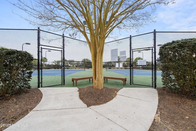 2016 Ashbrook Ct, Leland, NC 28451 - view of sport court with a gate, a tennis court, and fence