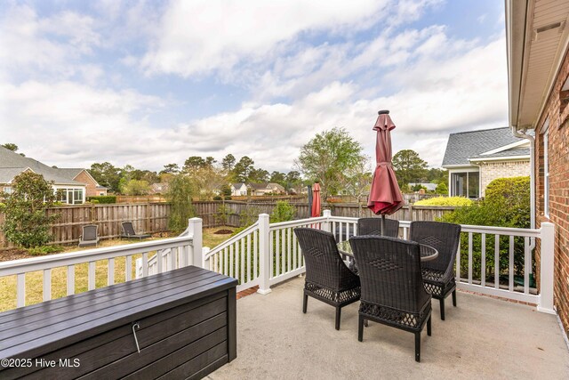 2016 Ashbrook Ct, Leland, NC 28451 - view of patio featuring outdoor dining space and a deck