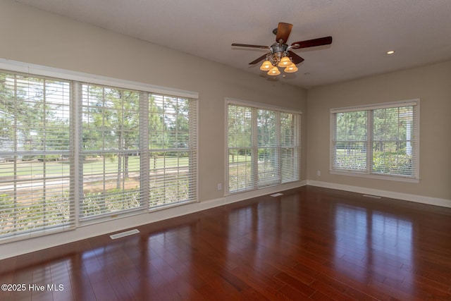 unfurnished room featuring baseboards, ceiling fan, wood finished floors, and recessed lighting