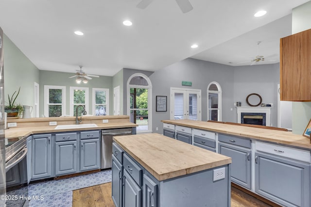 707 Brown Pelican Ln, Hampstead, NC 28443 - kitchen featuring ceiling fan, butcher block counters, a sink, and recessed lighting