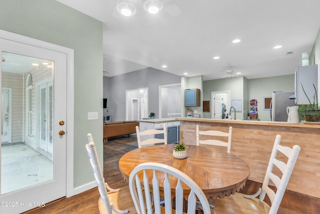 707 Brown Pelican Ln, Hampstead, NC 28443 - dining room with ceiling fan, wood finished floors, recessed lighting, and baseboards