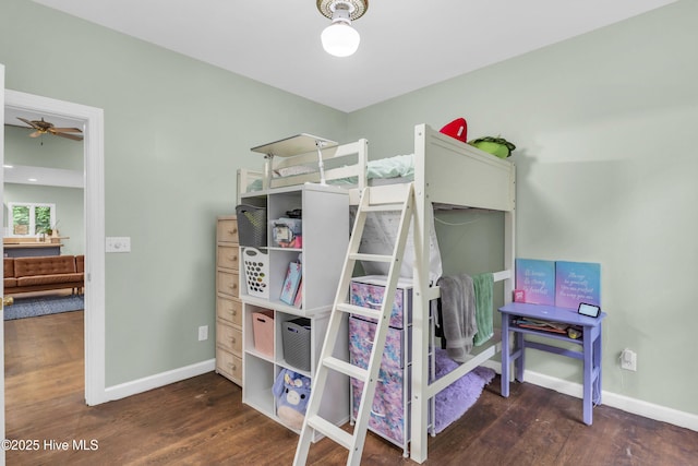 707 Brown Pelican Ln, Hampstead, NC 28443 - bedroom with baseboards and wood finished floors