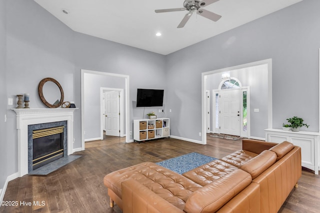 707 Brown Pelican Ln, Hampstead, NC 28443 - living room featuring wood finished floors, ceiling fan, a fireplace, baseboards, and recessed lighting