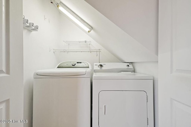 washroom featuring washing machine and dryer