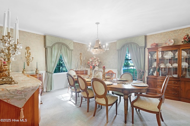 dining room with wallpapered walls, light carpet, plenty of natural light, a chandelier, and crown molding