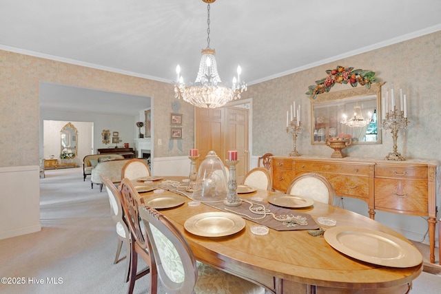 dining room featuring a chandelier, wallpapered walls, light carpet, and ornamental molding