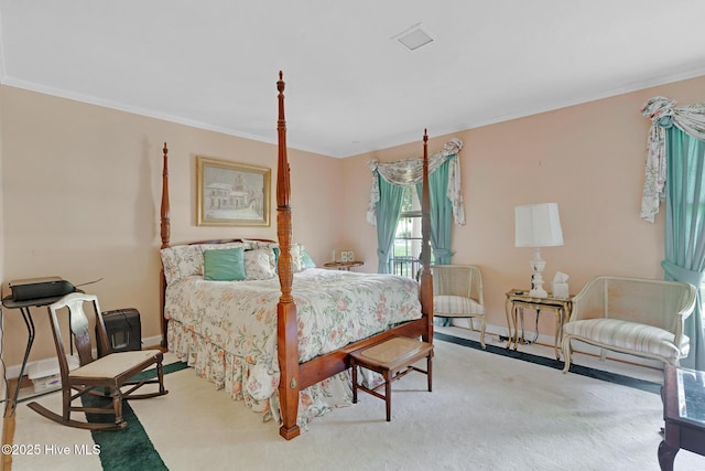 bedroom with crown molding and baseboards