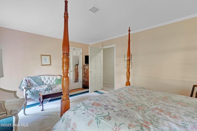 carpeted bedroom with ornamental molding