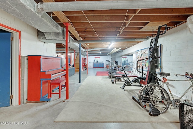 exercise area featuring concrete block wall