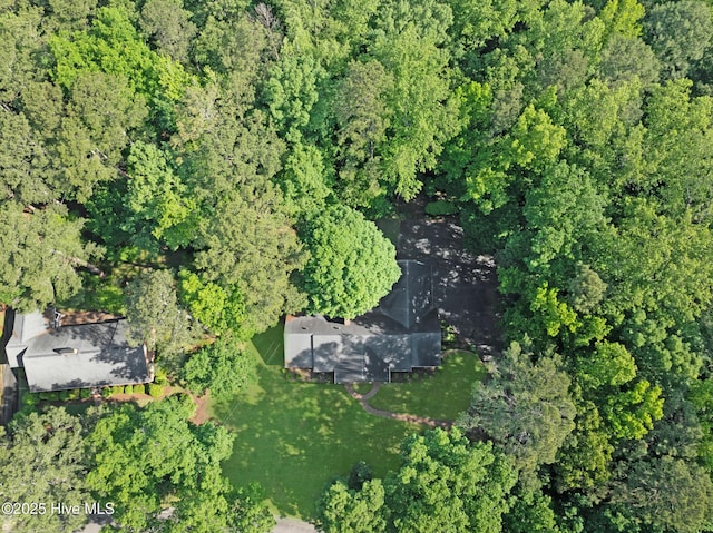 aerial overview of property's location with a forest