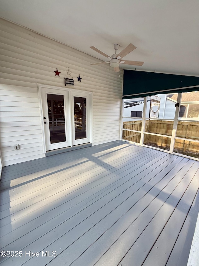 wooden terrace featuring a ceiling fan