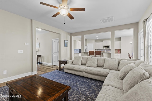 211 Willow Ridge Dr, Holly Ridge, NC 28445 - living room with wood finished floors, ceiling fan, and baseboards