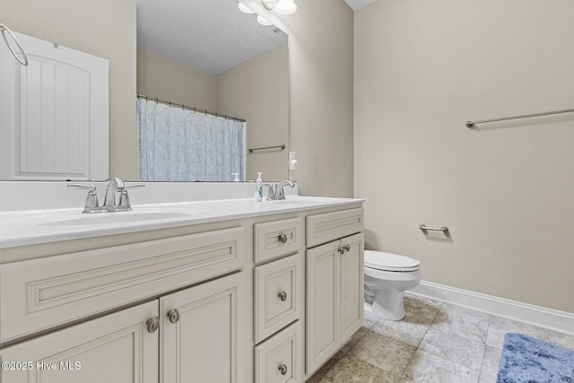 211 Willow Ridge Dr, Holly Ridge, NC 28445 - bathroom with toilet, baseboards, double vanity, and curtained shower