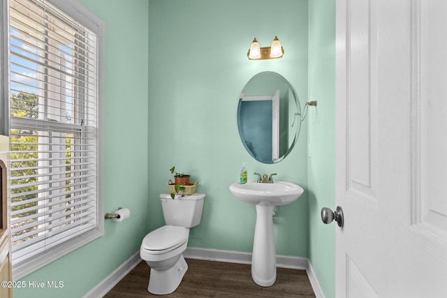 134 Inverness Dr, Hubert, NC 28539 - half bath with baseboards, toilet, wood finished floors, and healthy amount of natural light
