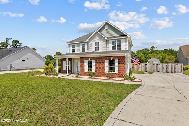 134 Inverness Dr, Hubert, NC 28539 - view of front of house with a gate, brick siding, and concrete driveway