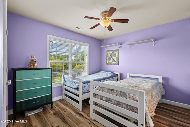 134 Inverness Dr, Hubert, NC 28539 - bedroom with baseboards, wood finished floors, and a ceiling fan