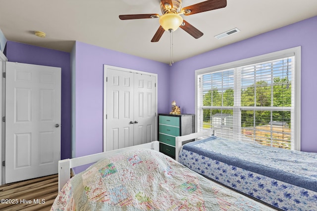134 Inverness Dr, Hubert, NC 28539 - bedroom with wood finished floors, a closet, and ceiling fan