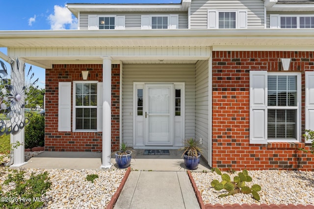134 Inverness Dr, Hubert, NC 28539 - entrance to property featuring brick siding and a porch