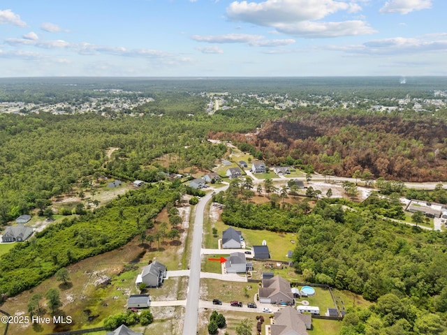 134 Inverness Dr, Hubert, NC 28539 - aerial view of property and surrounding area featuring a heavily wooded area and nearby suburban area