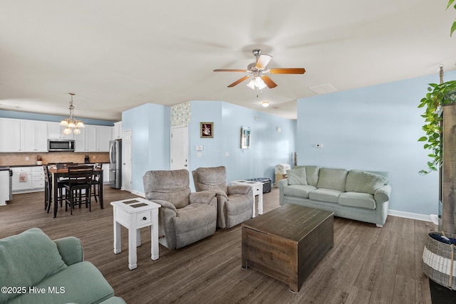 134 Inverness Dr, Hubert, NC 28539 - living area featuring ceiling fan, dark wood-style flooring, a chandelier, and baseboards