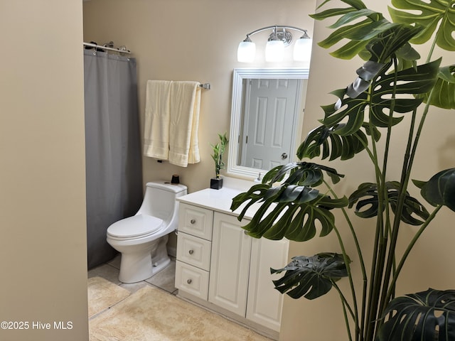 full bath with toilet, tile patterned flooring, and vanity