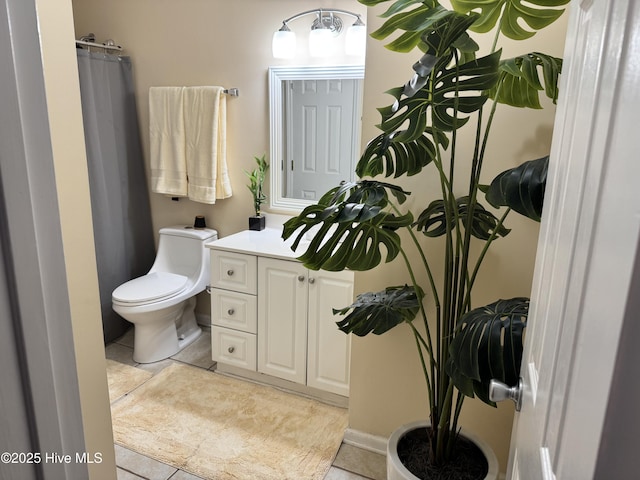 bathroom with tile patterned floors, a bath, a shower with door, and baseboards