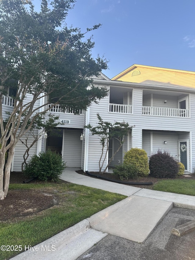 view of front of house featuring a balcony