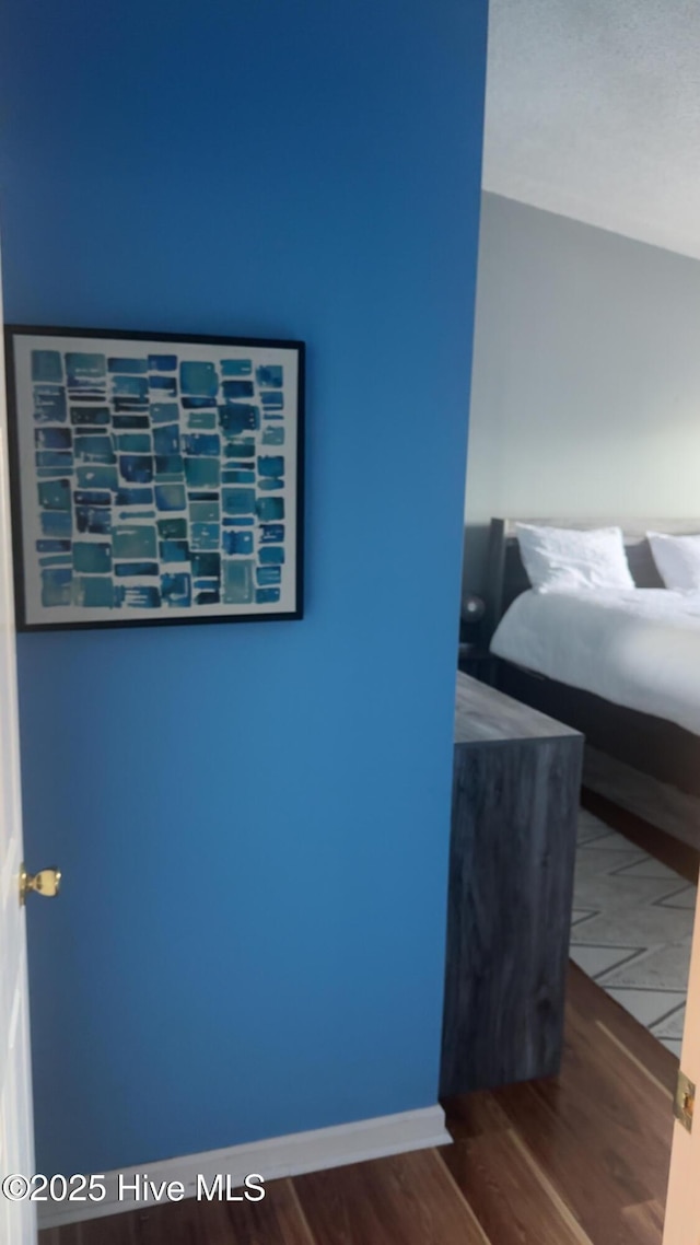 bedroom featuring wood finished floors