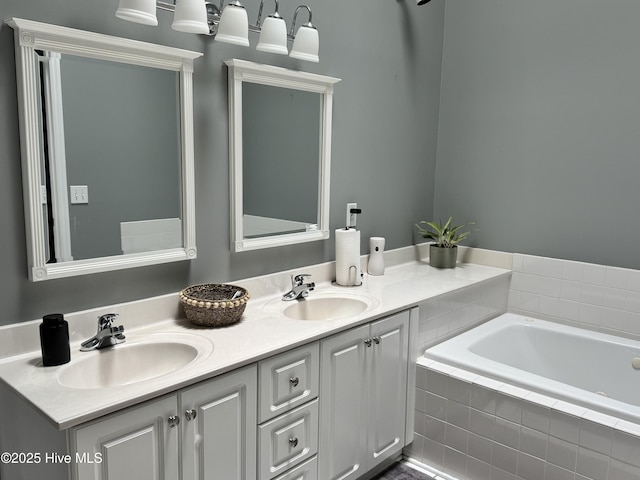full bathroom featuring double vanity and a relaxing tiled tub