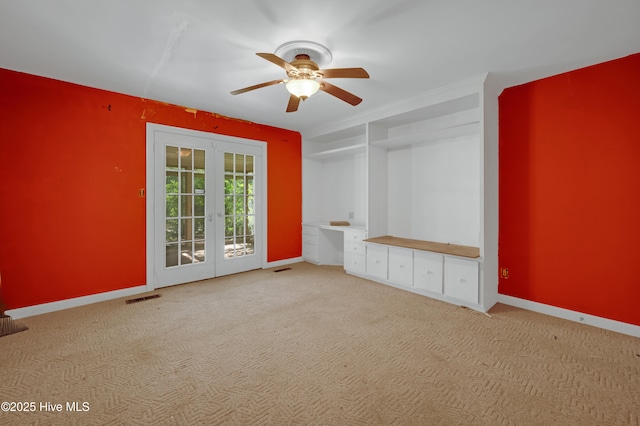 spare room with french doors, a ceiling fan, carpet flooring, and baseboards