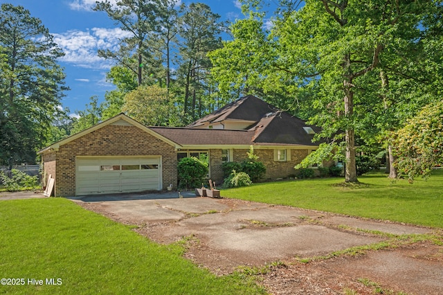 view of front of house with asphalt driveway, a garage, a front lawn, and brick siding