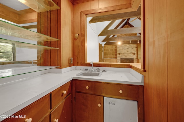 bathroom with vanity and wood walls